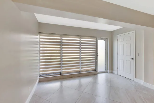 a view of kitchen with stainless steel appliances cabinets and counter space