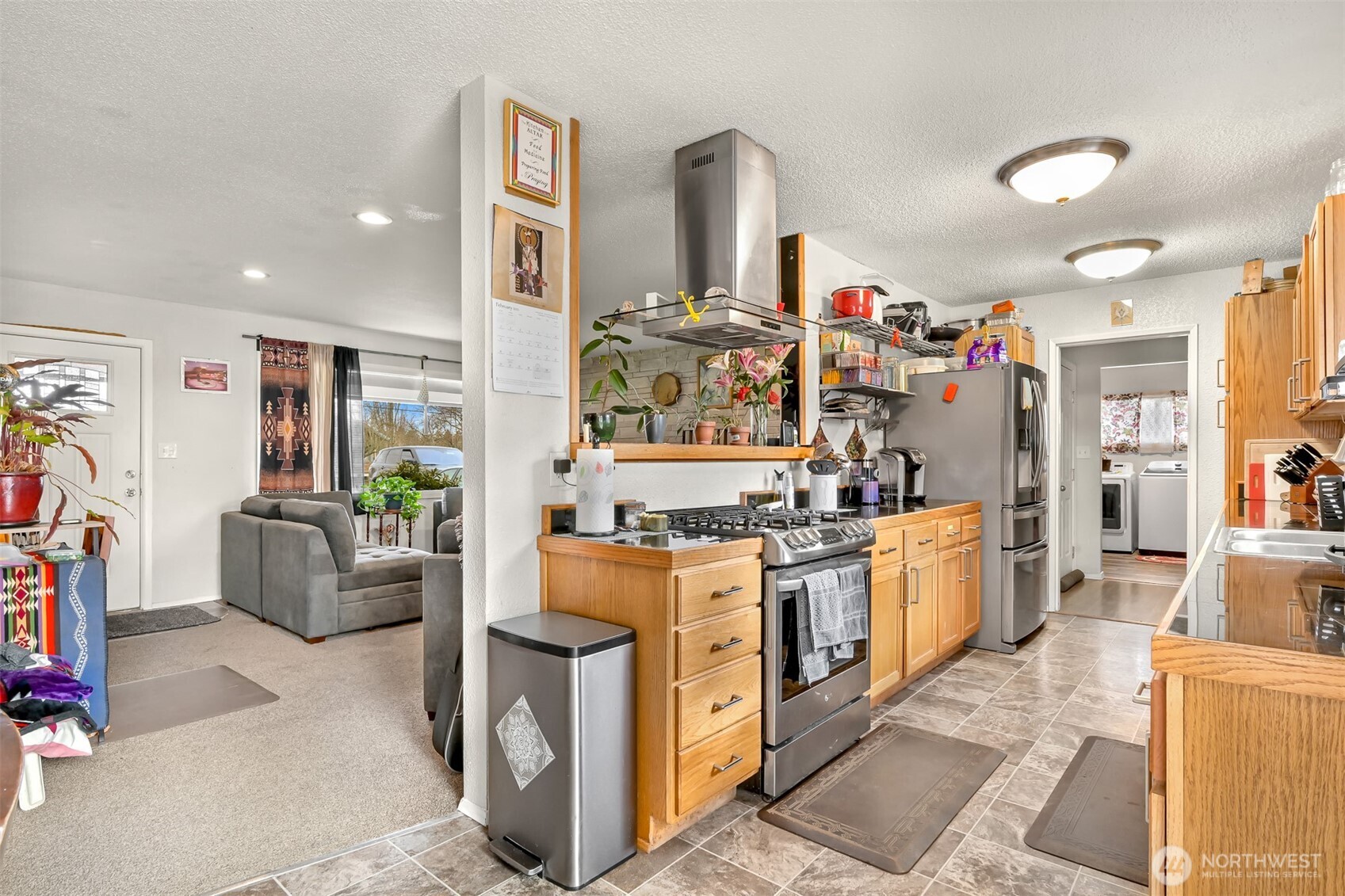 953 Slater Road Bellingham, WA 98226 - Photo 11 of 25 a kitchen with stainless steel appliances granite countertop a stove and cabinets