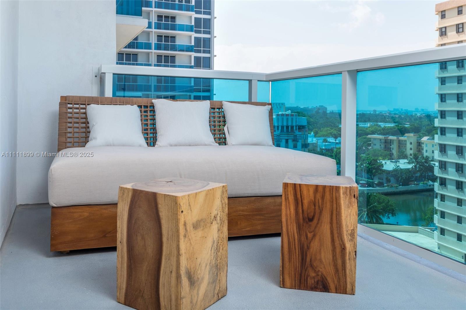 102 24th Street, Unit 1015 Miami Beach, FL 33139 - Photo 19 of 20 a bedroom with a bed and large window