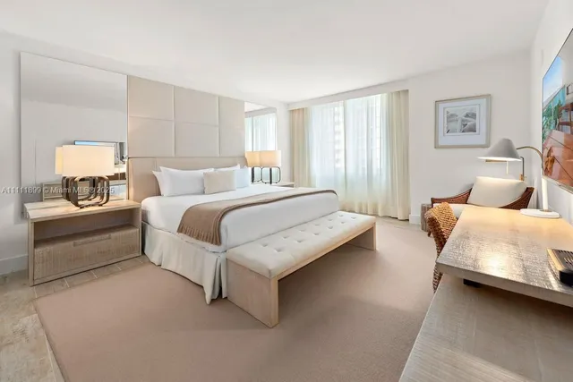 a bedroom with a bed and a couch