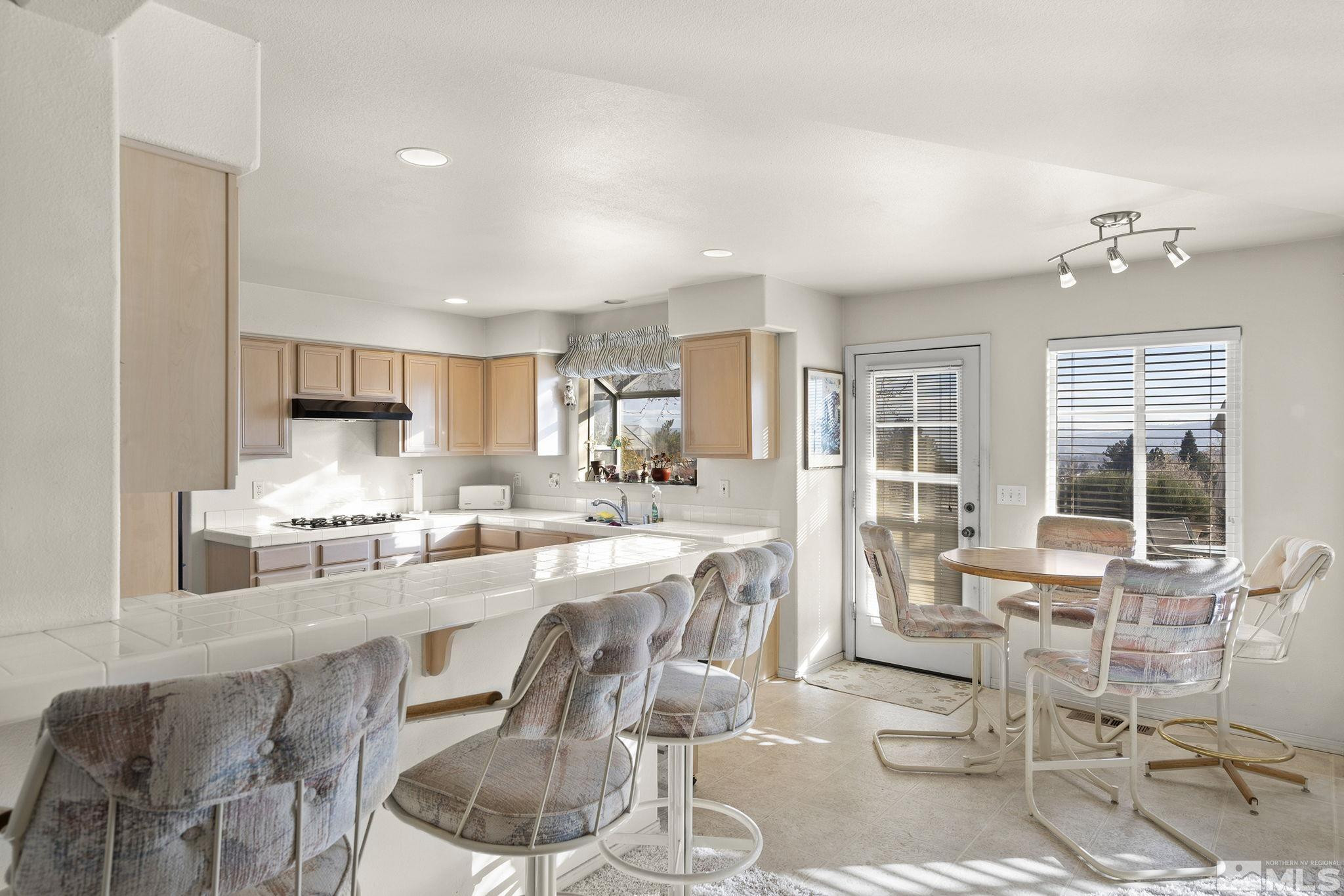 5364 Tappan Court Reno, NV 89523 - Photo 14 of 40 a large kitchen with a table and chairs