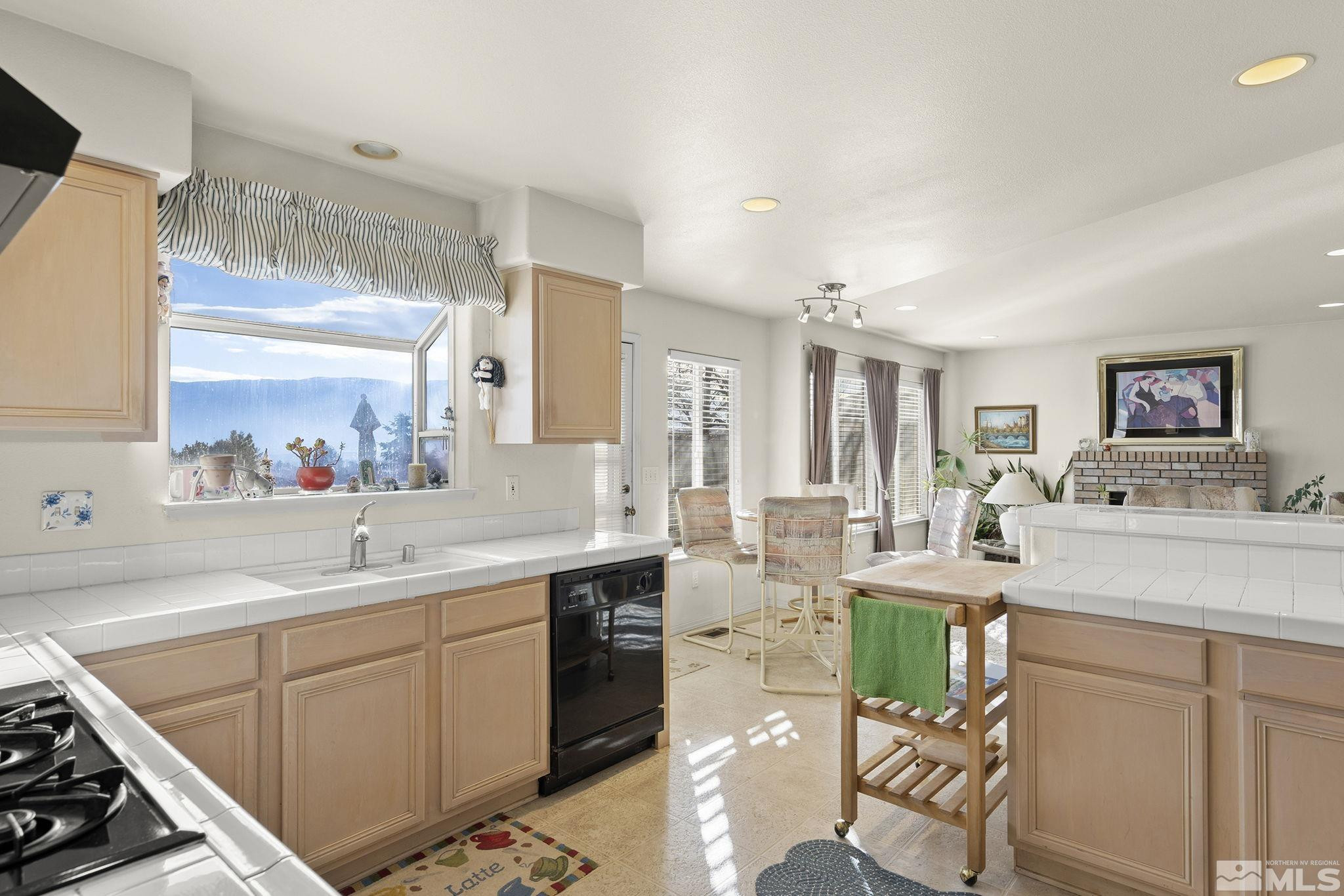 5364 Tappan Court Reno, NV 89523 - Photo 18 of 40 a kitchen with a sink cabinets and window
