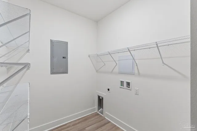 a kitchen with a refrigerator and cabinets