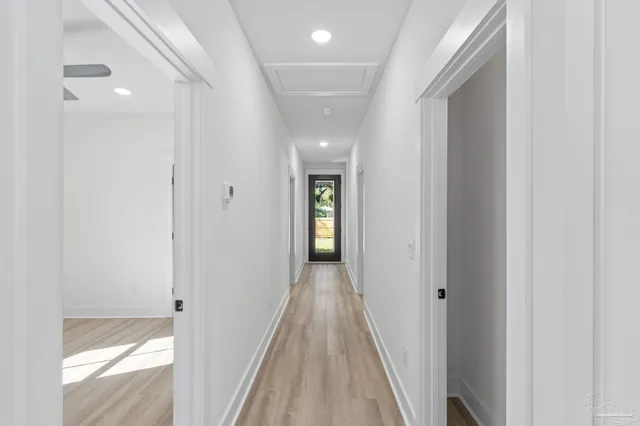 a view of empty room with a window and a ceiling fan