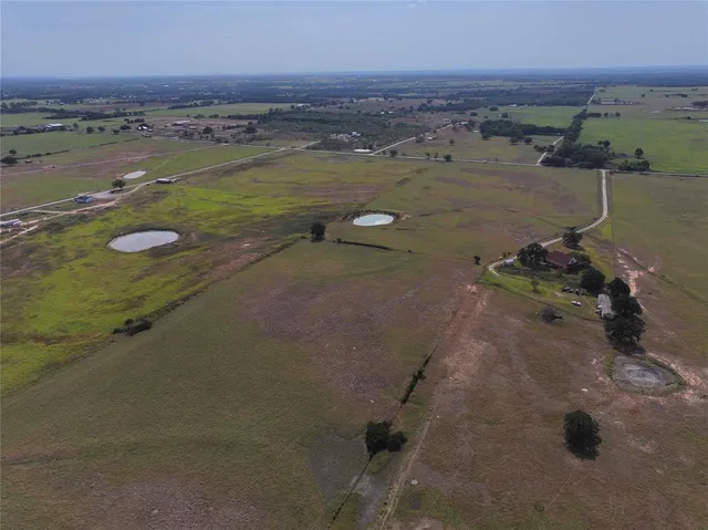 an aerial view of ocean with beach