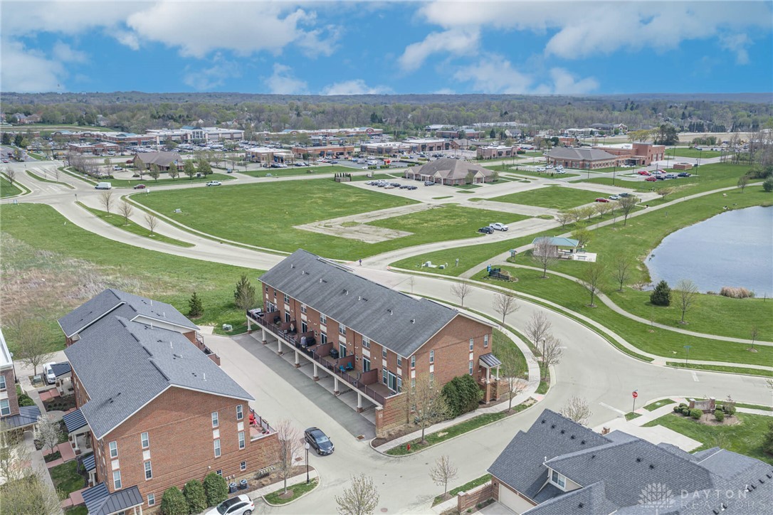 407 Brownstone Row Springboro, OH 45066 - Photo 53 of 54 This elevated perspective showcases residential buildings with scenic views of a pond and open spaces.
