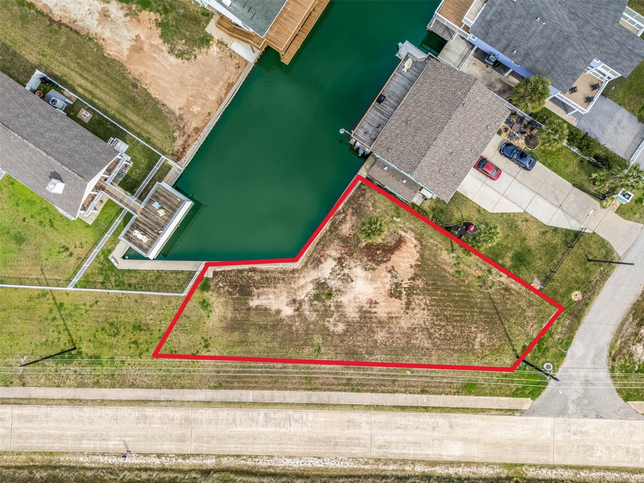 16714 Curlew Road Jamaica Beach, TX 77554 - Photo 2 of 13 a view of outdoor space and basketball court