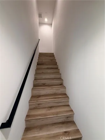 a view of cars parked in front of a house