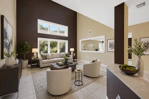 a view of a dining room with furniture and a table