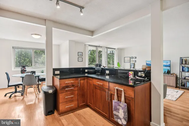 a kitchen with lots of counter top space and living room