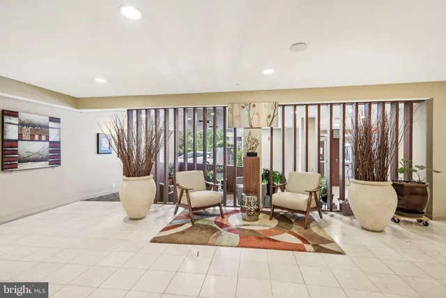 a living room with a large window and a table