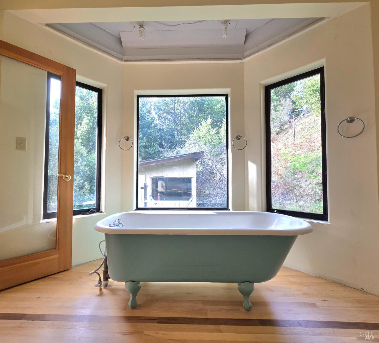 36955 Eureka Stagecoach Road Willits, CA 95490 - Photo 21 of 46 a room with a window and a wooden floor