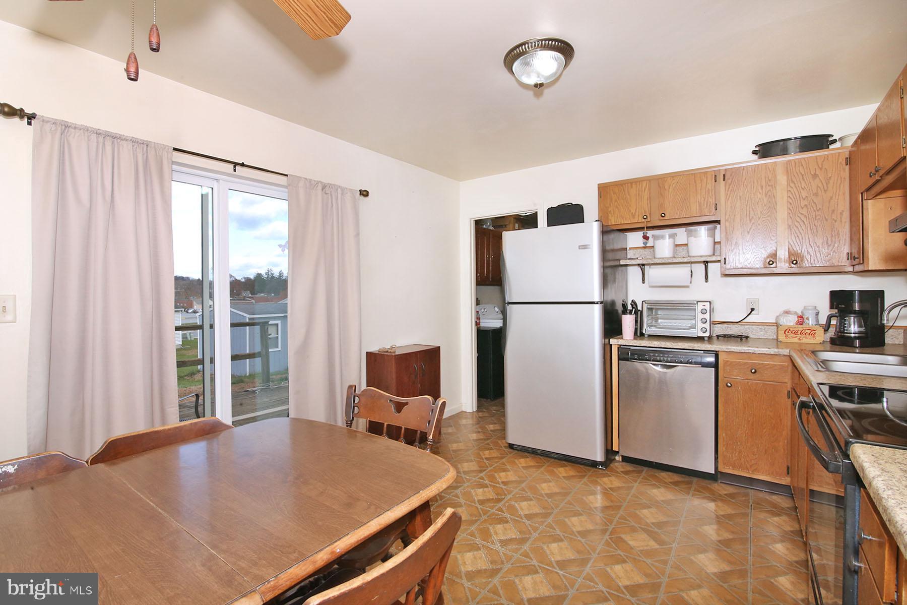 25 Walnut Mill Lane Cleona, PA 17042 - Photo 7 of 17 a kitchen with refrigerator a stove a sink and a refrigerator