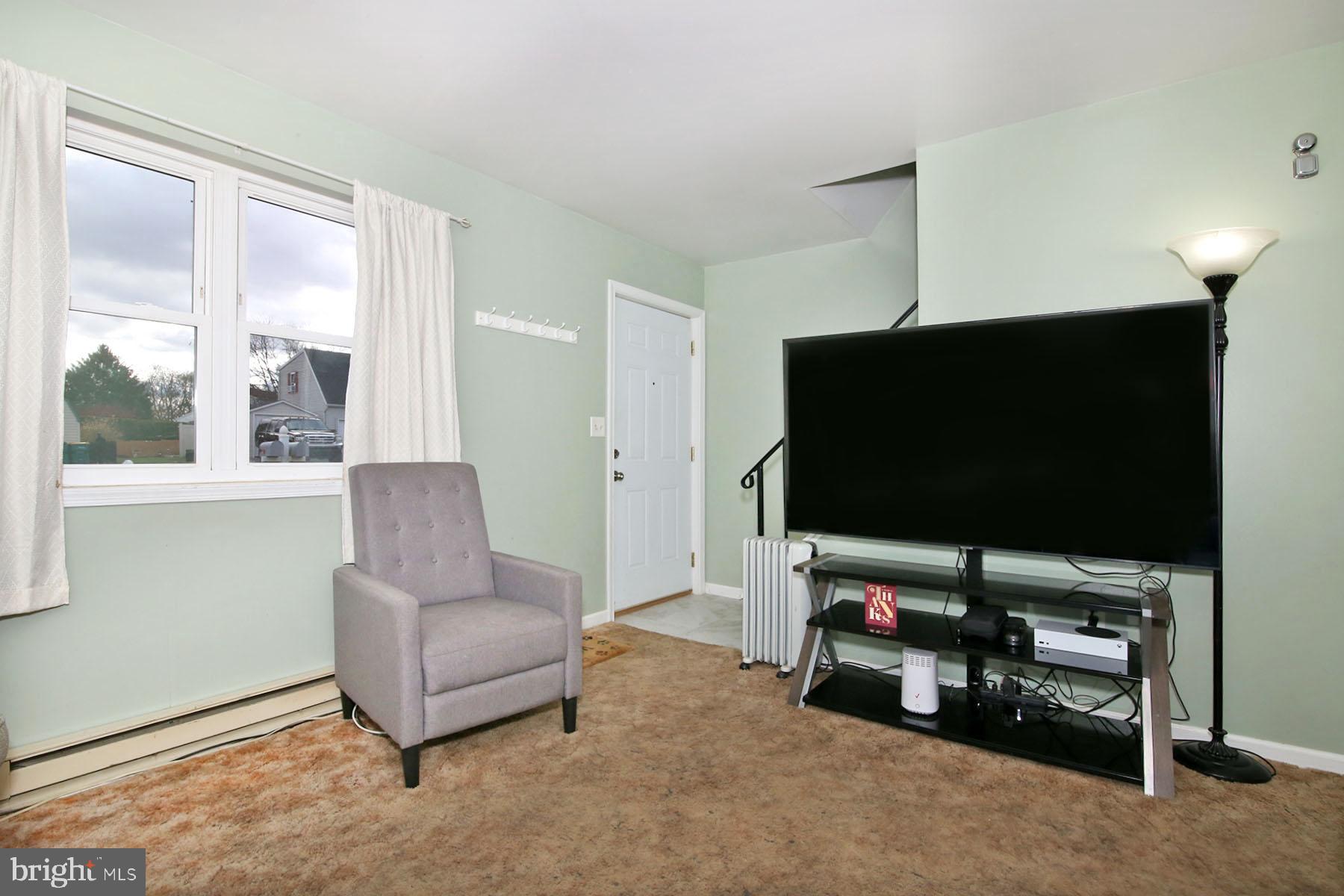 25 Walnut Mill Lane Cleona, PA 17042 - Photo 9 of 17 a living room with furniture and a flat screen tv
