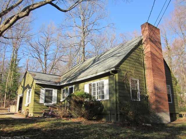 128 Bear Hill Road Bethany, CT 06524 - Photo 1 of 1 Exterior Front. South Side of home with trees in early Spring bud!