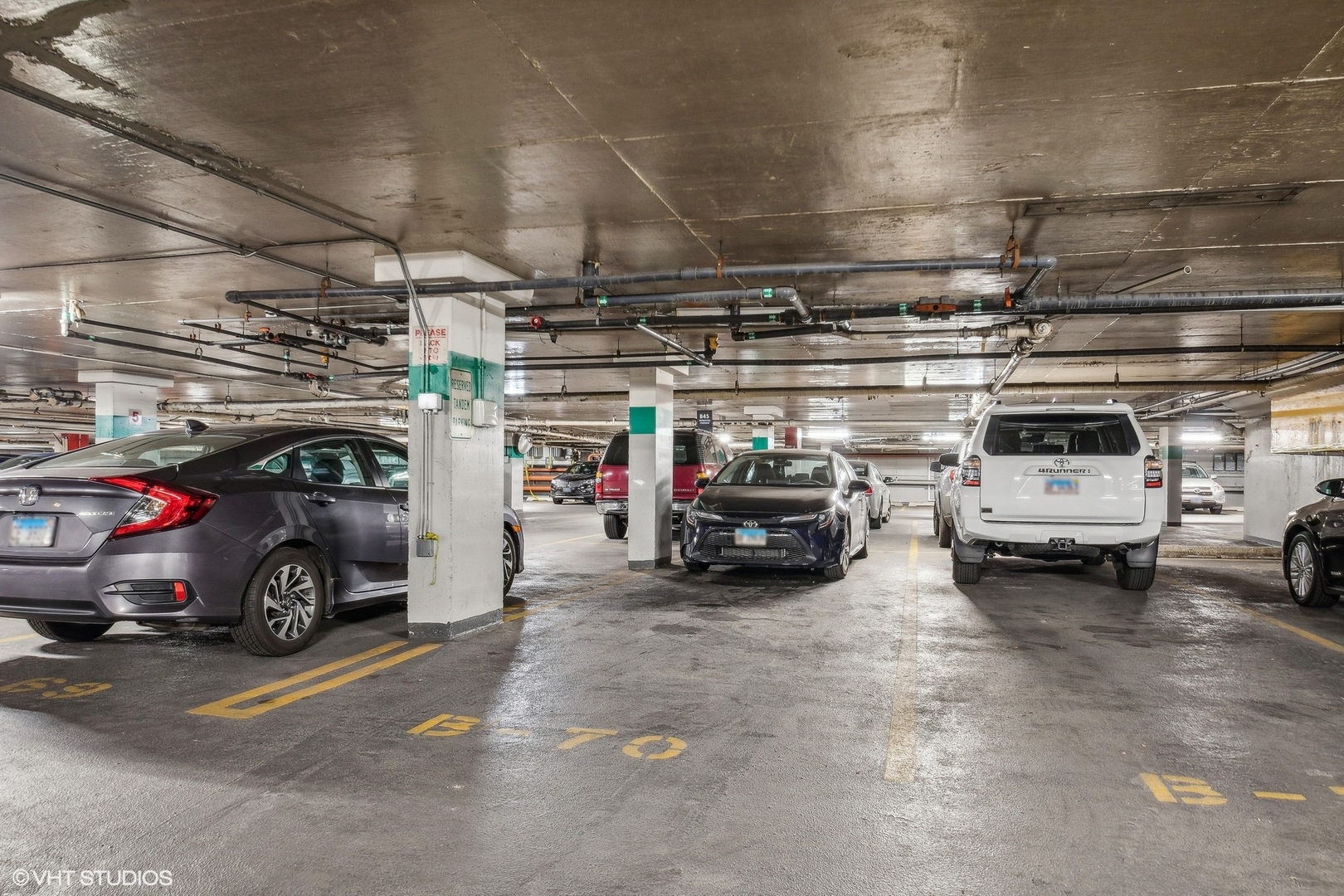 655 West Irving Park Road, Unit B70 Chicago, IL 60613 - Photo 2 of 4 a view of parking garage with cars and