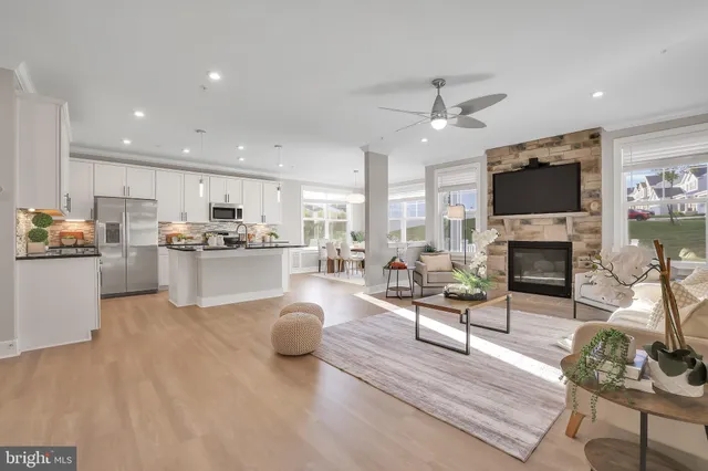 a living room with fireplace furniture and a flat screen tv