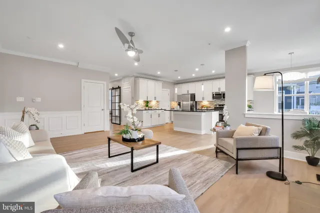 a view of a house with a wooden deck