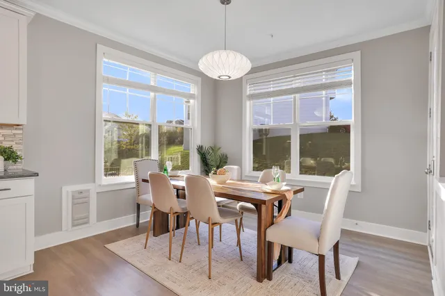 a view of a wooden deck with a yard