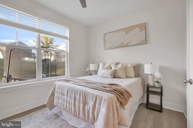 a bedroom with a bed and a couch