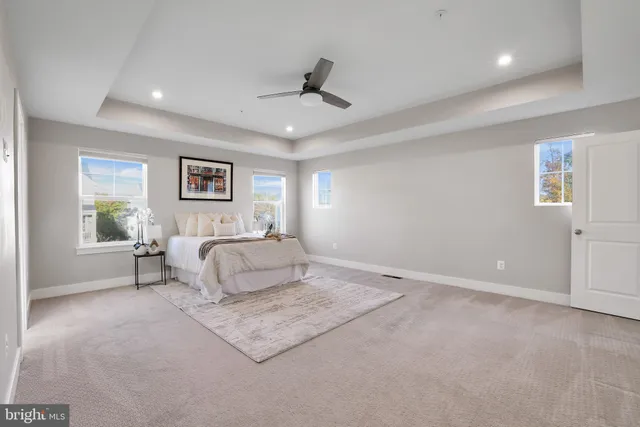 a bathroom with a double vanity sink a mirror and a bathtub