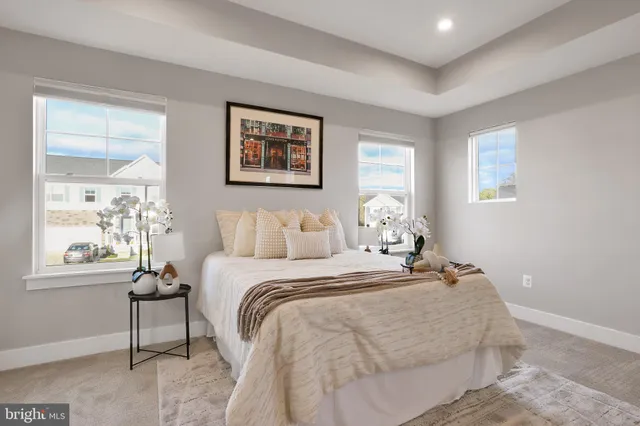 a white bath tub sitting next to a shower