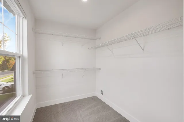 a bathroom with a granite countertop sink a toilet and bathtub