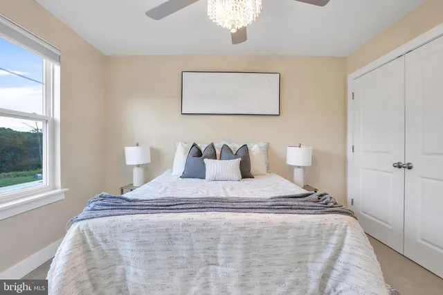 a view of a house with a backyard patio and swimming pool
