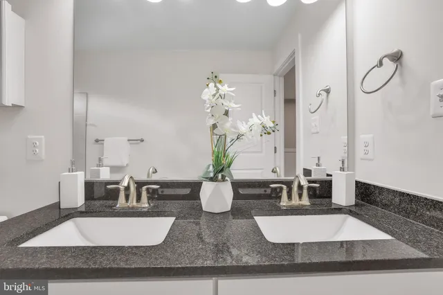 a view of a house with a big yard and sitting area