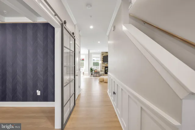 a kitchen with kitchen island granite countertop white cabinets and white appliances