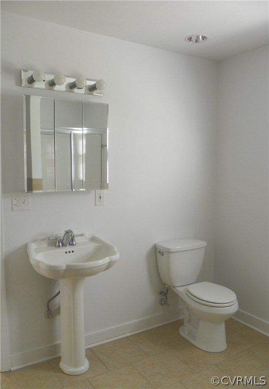 7900 Bull Hill Road Prince George, VA 23875 - Photo 16 of 24 a white toilet sitting next to a bathroom sink