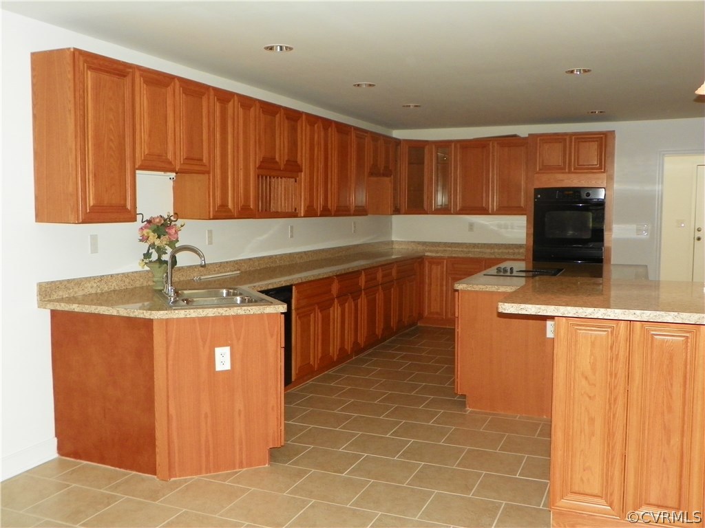 7900 Bull Hill Road Prince George, VA 23875 - Photo 6 of 24 a kitchen with stainless steel appliances granite countertop a sink counter space and cabinets