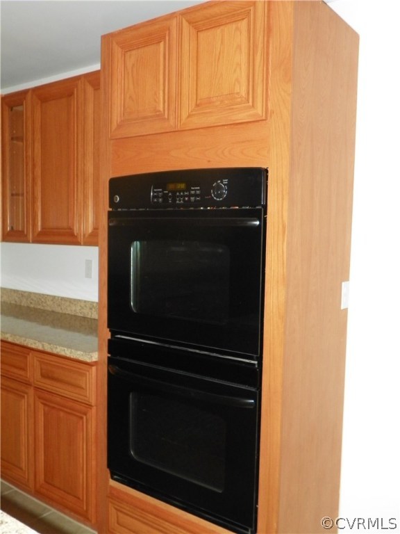 7900 Bull Hill Road Prince George, VA 23875 - Photo 9 of 24 a stove top oven sitting inside of a kitchen