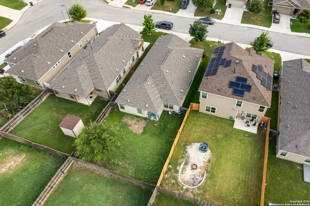 an aerial view of a house with a garden