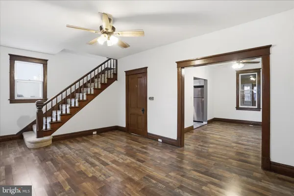 a view of an entryway with wooden floor