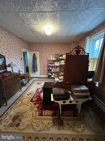 a living room with furniture and a rug