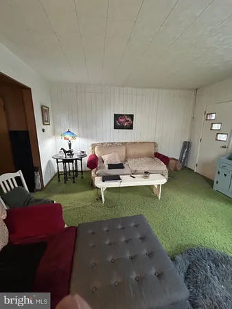 a living room with furniture window and a table