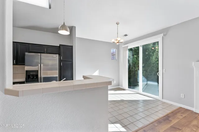 a view of a kitchen with a sink and a window