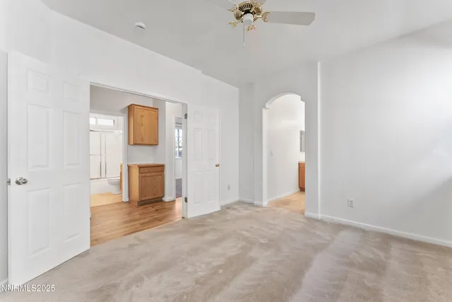 a view of an empty room with a fireplace