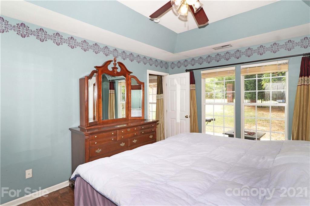 120 Cinebar Road Mooresville, NC 28115 - Photo 15 of 36 a bedroom with a bed and a large window