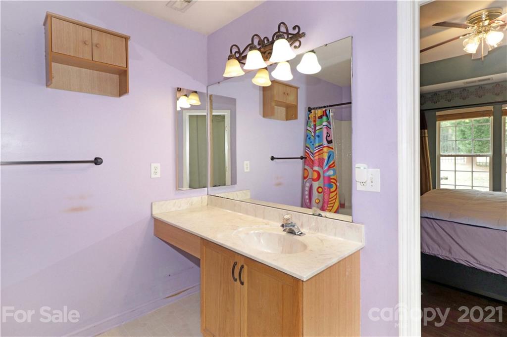 120 Cinebar Road Mooresville, NC 28115 - Photo 19 of 36 a bathroom with a sink vanity and a mirror