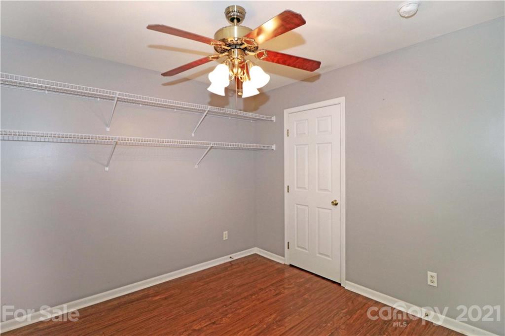 120 Cinebar Road Mooresville, NC 28115 - Photo 26 of 36 an empty room with a window and a ceiling fan
