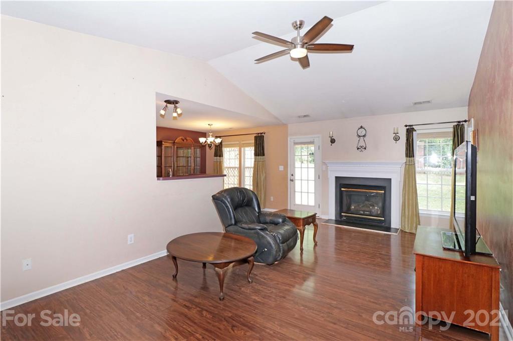 120 Cinebar Road Mooresville, NC 28115 - Photo 4 of 36 a living room with furniture and a fireplace