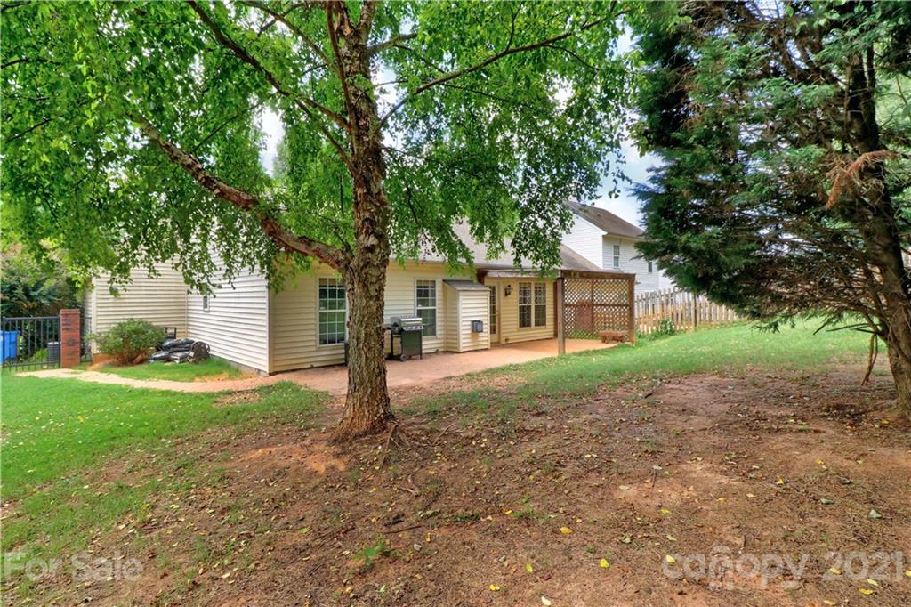120 Cinebar Road Mooresville, NC 28115 - Photo 31 of 36 a view of a yard with a house and a tree