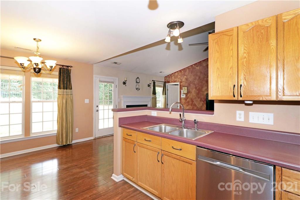 120 Cinebar Road Mooresville, NC 28115 - Photo 10 of 36 a kitchen with a sink cabinets and window