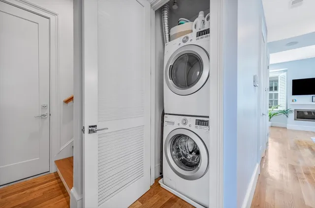 a view of a hallway with washer and dryer