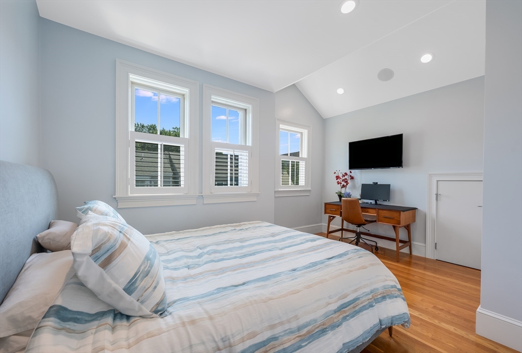 480 East 4th Street, Unit 3 Boston, MA 02127 - Photo 13 of 25 a bedroom with a bed and wooden floor