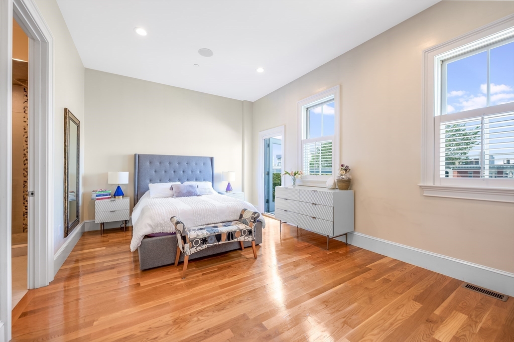 480 East 4th Street, Unit 3 Boston, MA 02127 - Photo 16 of 25 a spacious bedroom with a bed and a large window