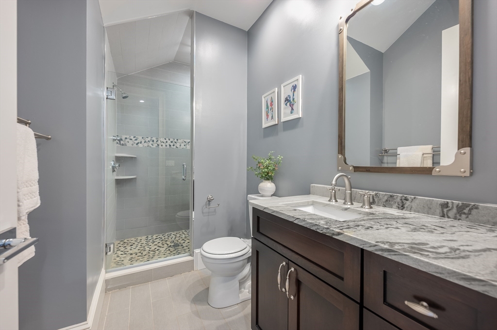 480 East 4th Street, Unit 3 Boston, MA 02127 - Photo 17 of 25 a bathroom with a granite countertop sink toilet and shower