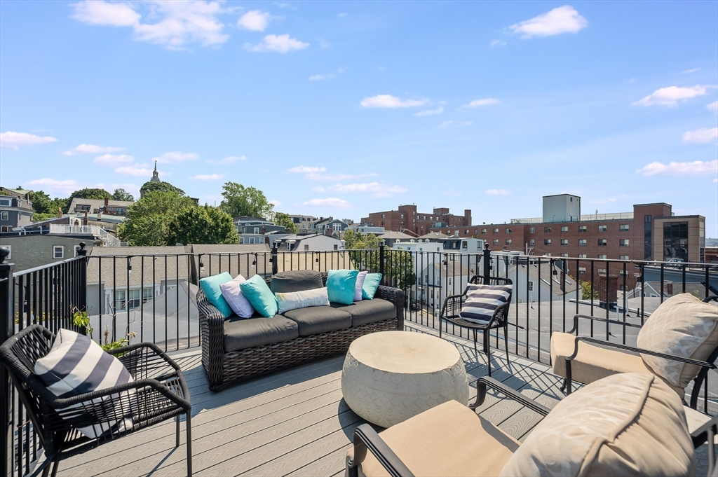 480 East 4th Street, Unit 3 Boston, MA 02127 - Photo 20 of 25 a balcony with furniture and city view
